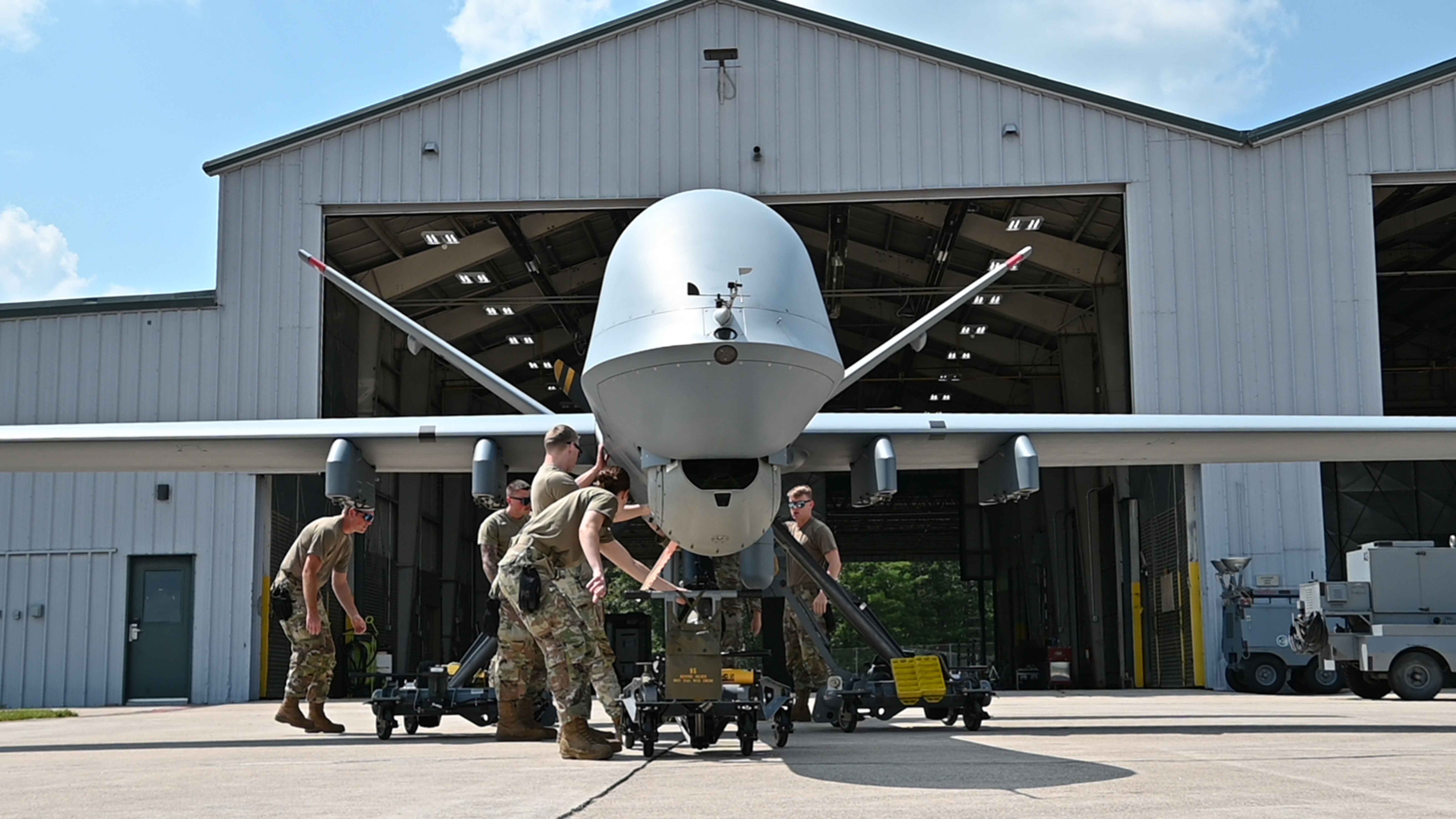reaper drone in front of hangar