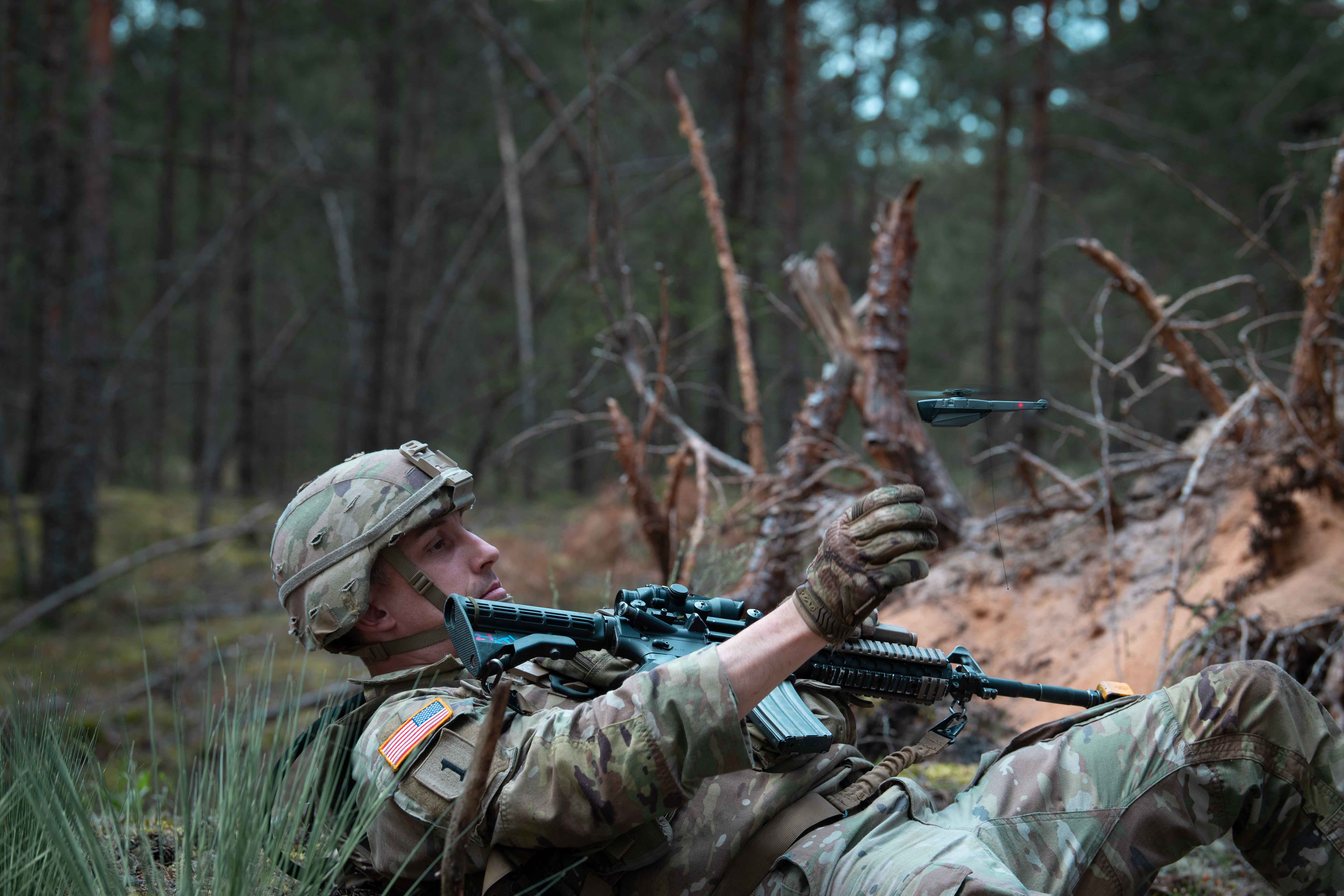U.S. Army Soldier trains with a small drone.