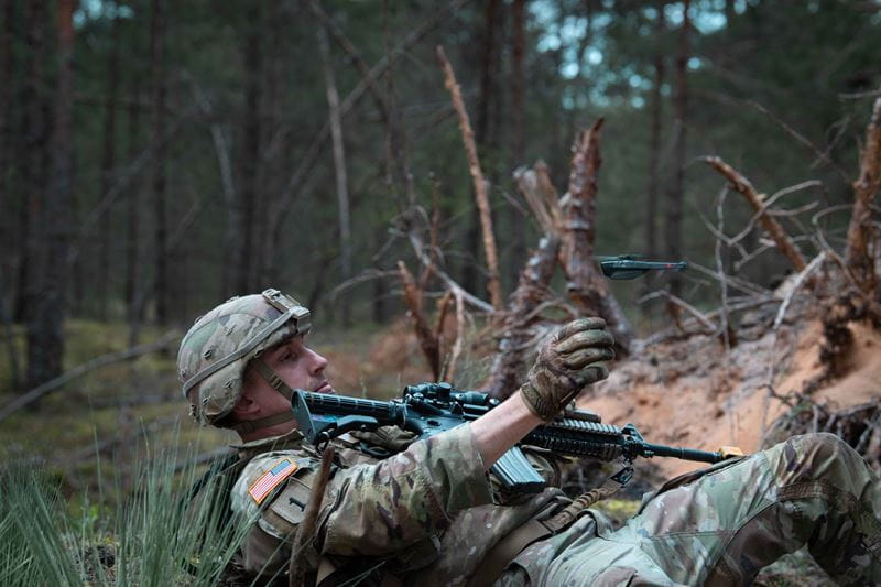U.S. Army Soldier trains with a small drone.