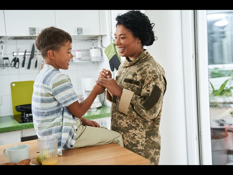 Award recipients stand on stage at the gala displaying their certificate