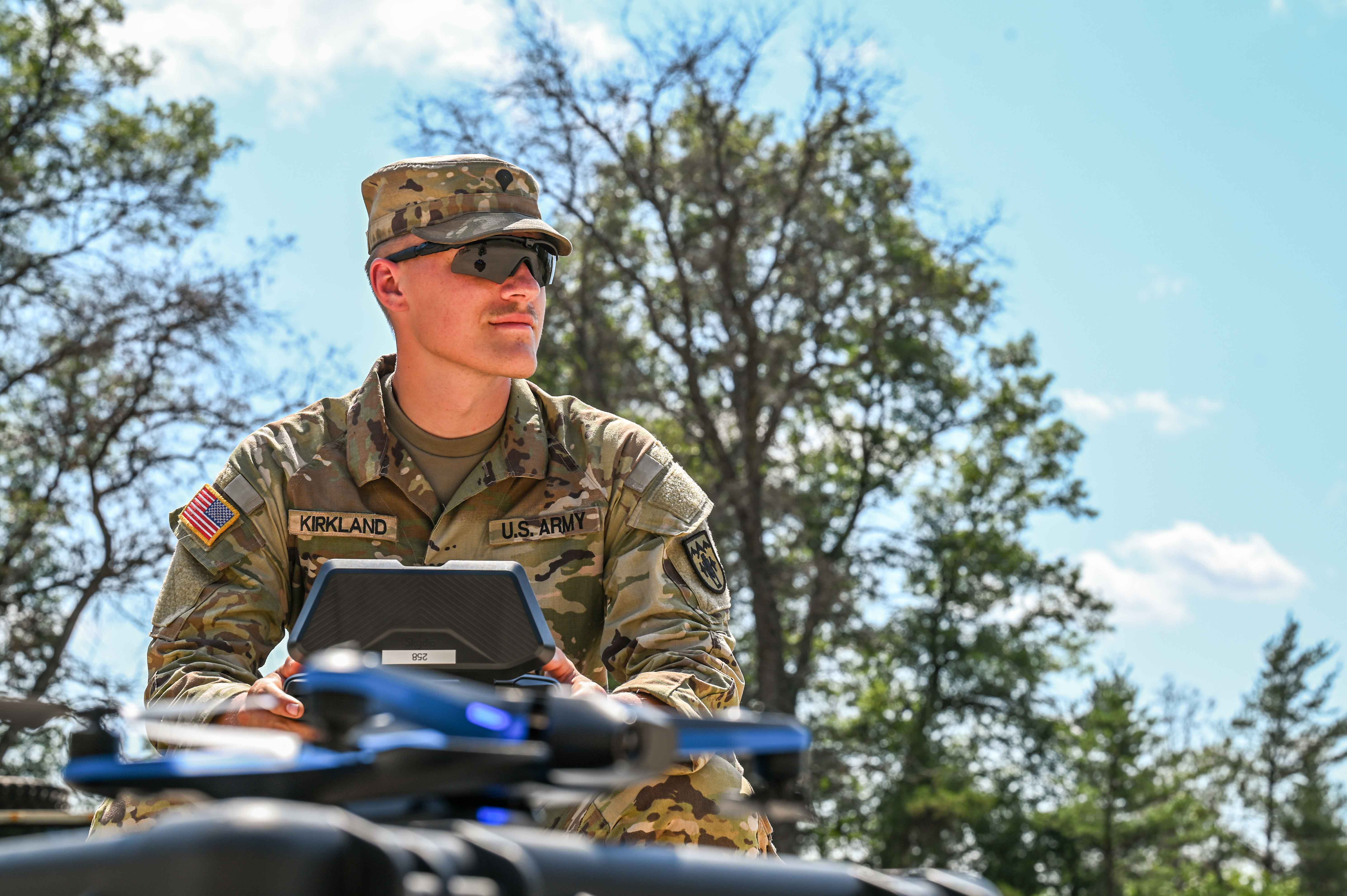 Soldier directs a drone during training.