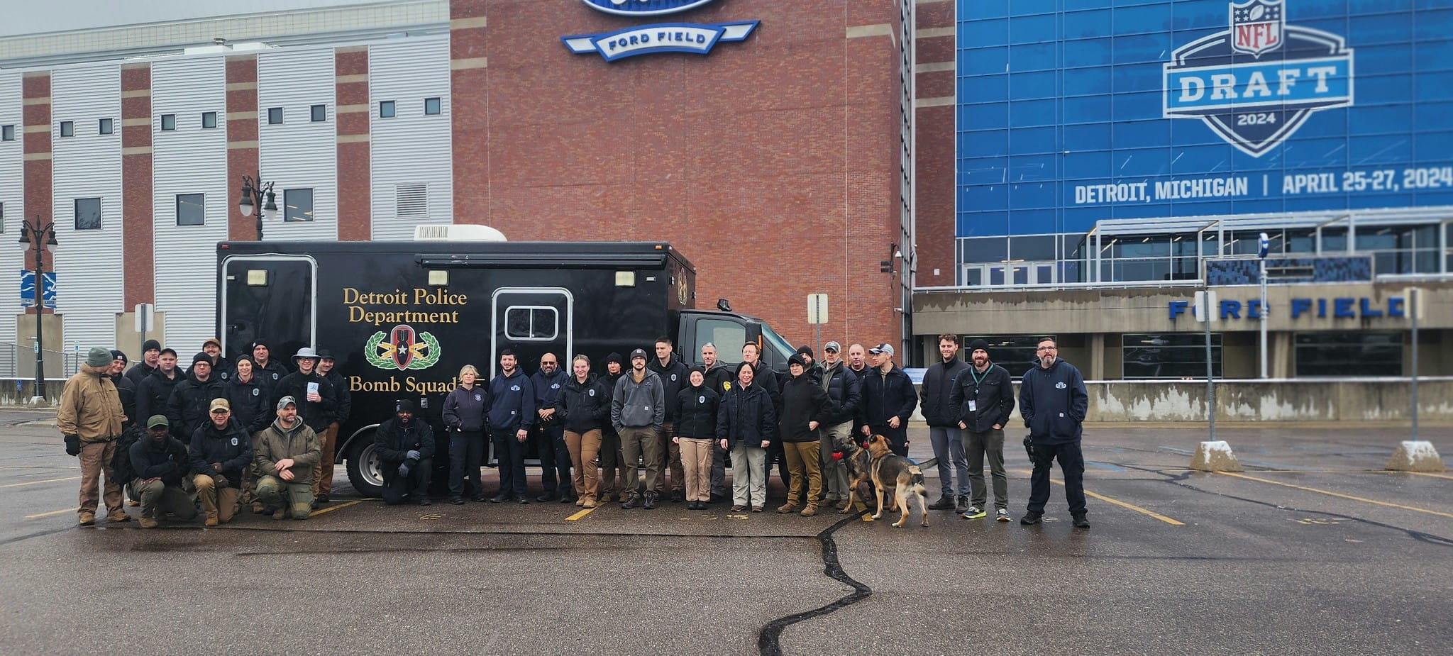 soldiers stand outside ford field