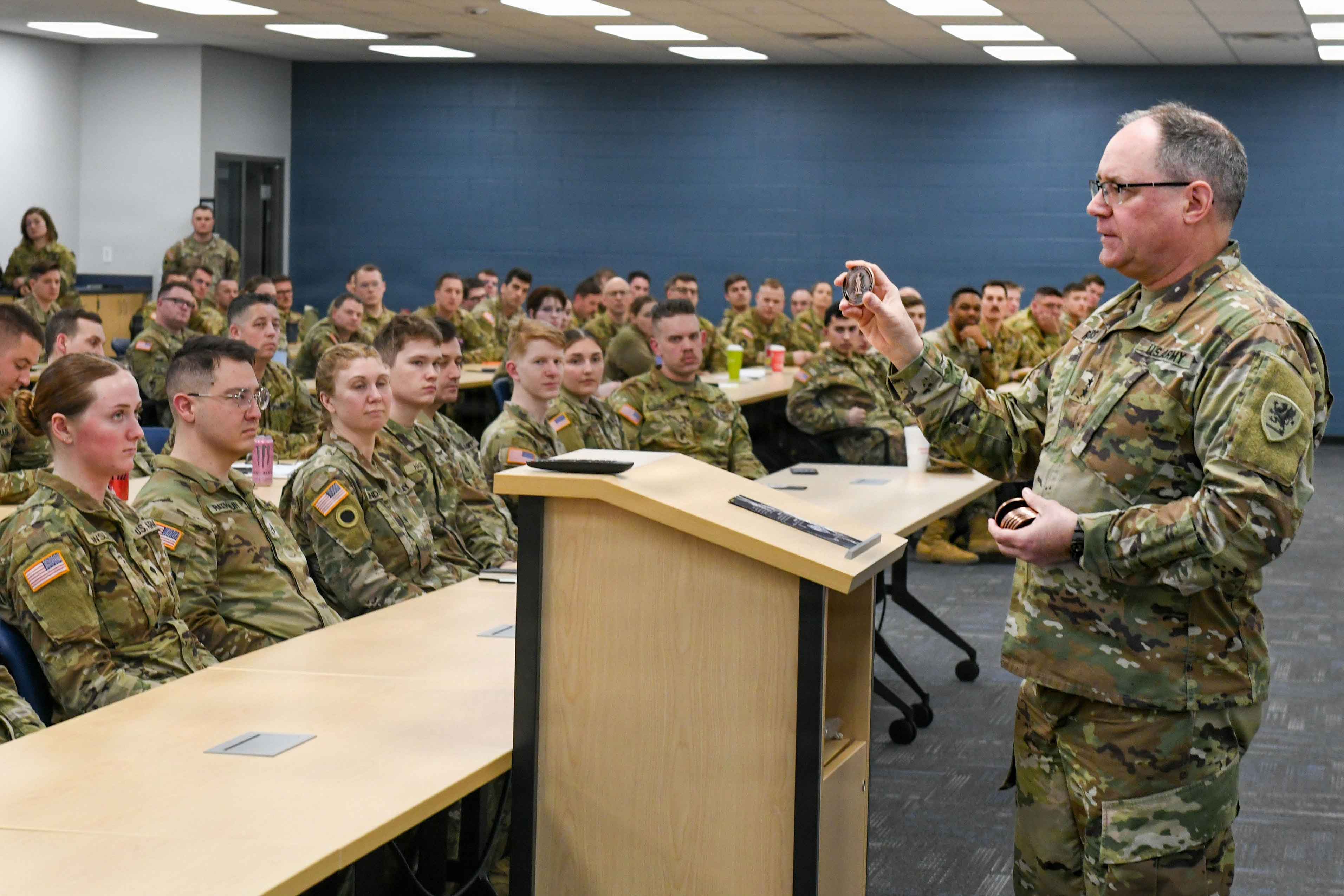 General Rogers addresses room of Soldiers