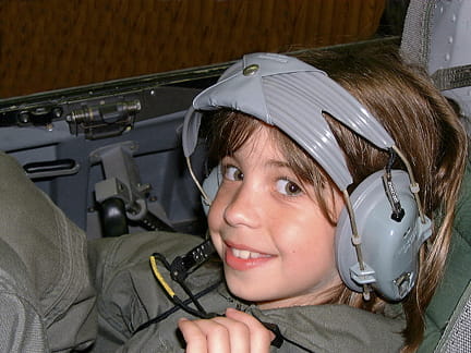 A STARBASE student experiences the cockpit of an F-16 fighter.