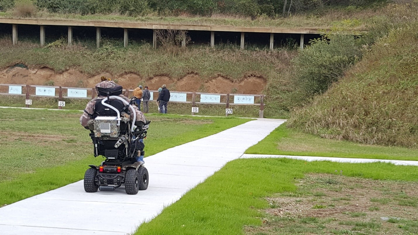 Man in wheelchair on accessible path to targets at DNR Sharonville Shooting Range