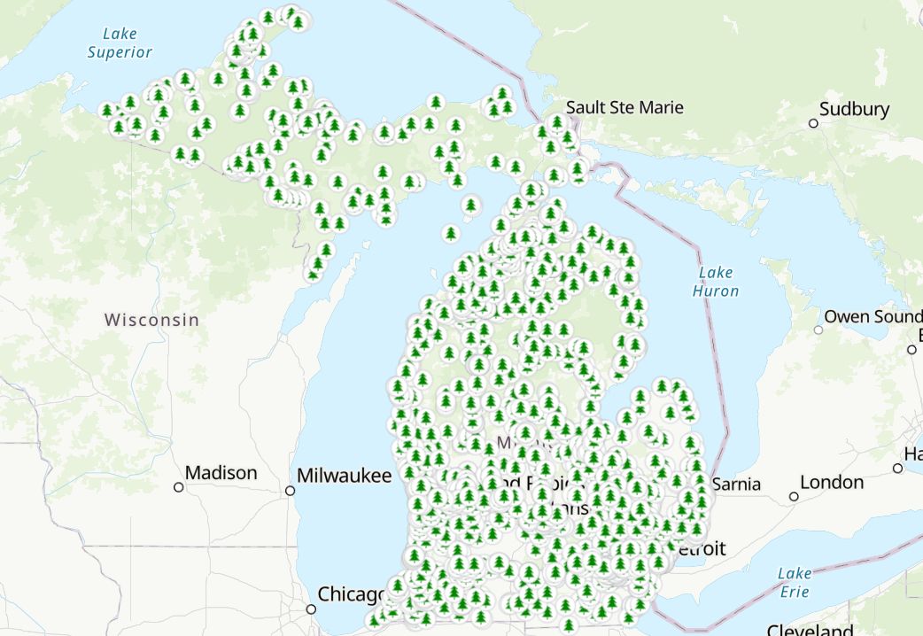 Map of Michigan showing pine tree symbols representing each MNRTF funded site.