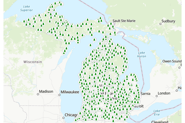 Map of Michigan showing pine tree symbols representing each MNRTF funded site.