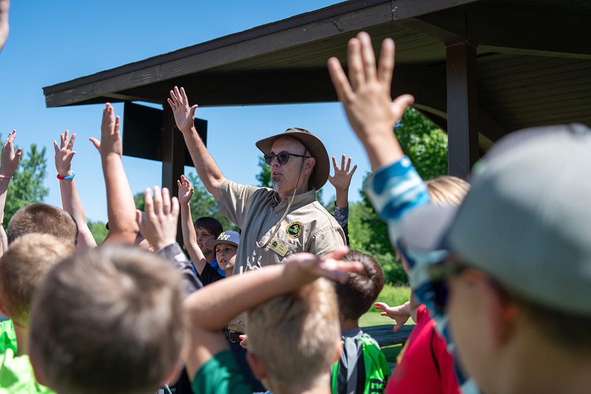 A DNR educator with a group of students