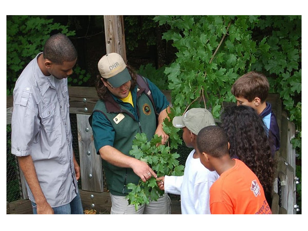 Craig giving a tour to a group of kids