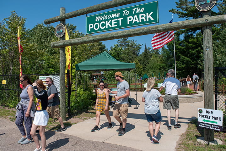 Visitors coming and going at the entrance to the Pocket Park