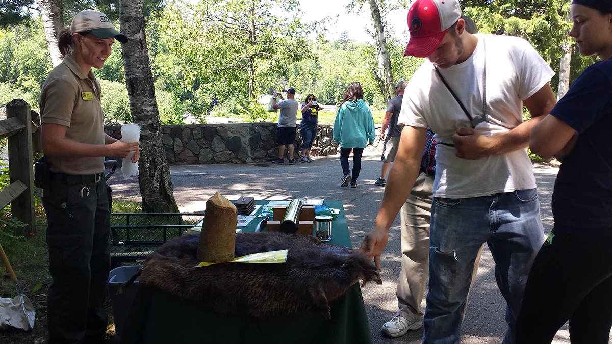 Visitors at the discovery table at the Porkies Visitor Center