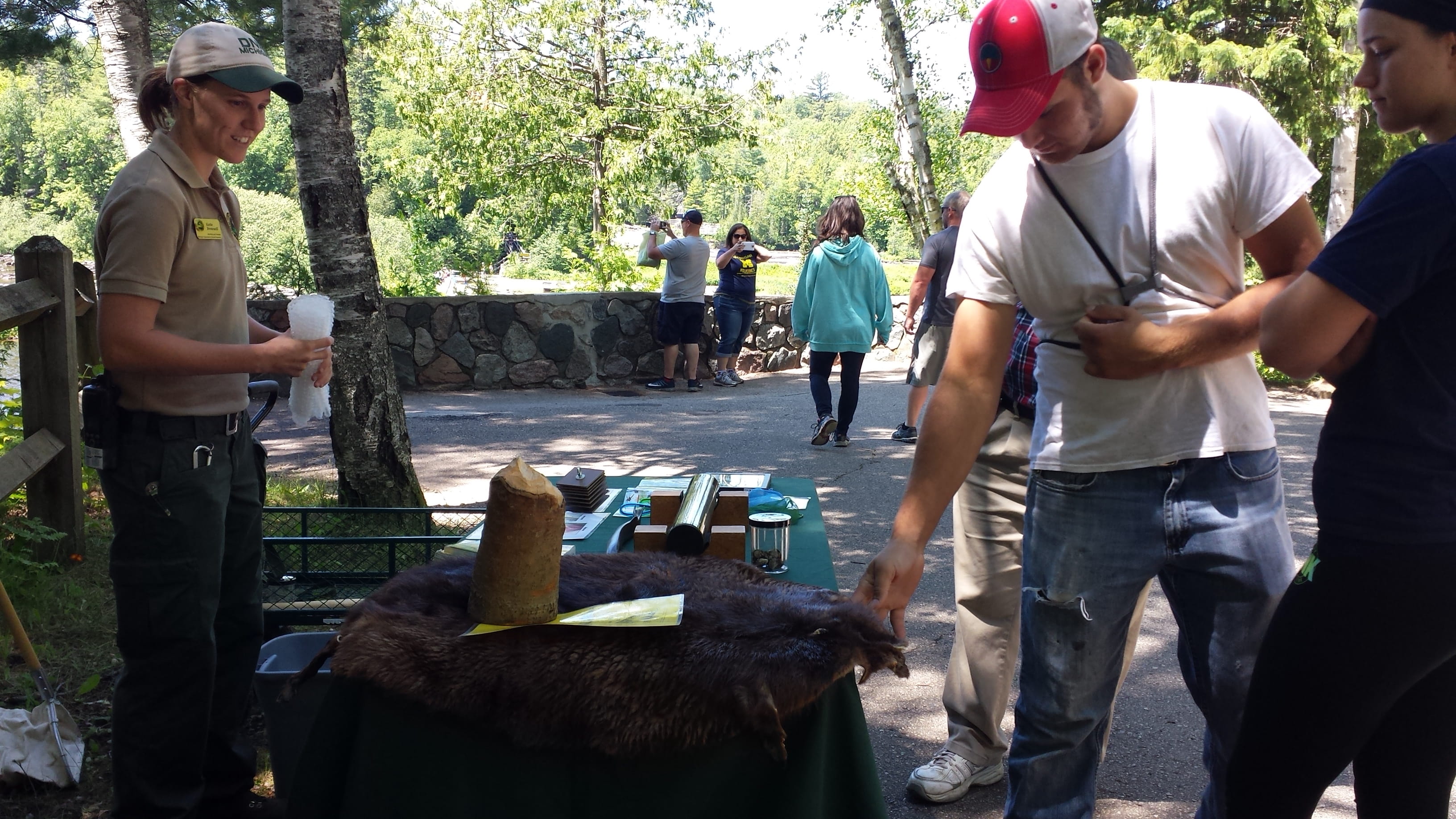 Visitors at the discovery table at the Porkies Visitor Center