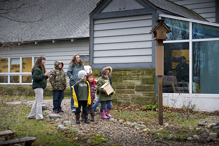 A group walks outside for an interpretive program