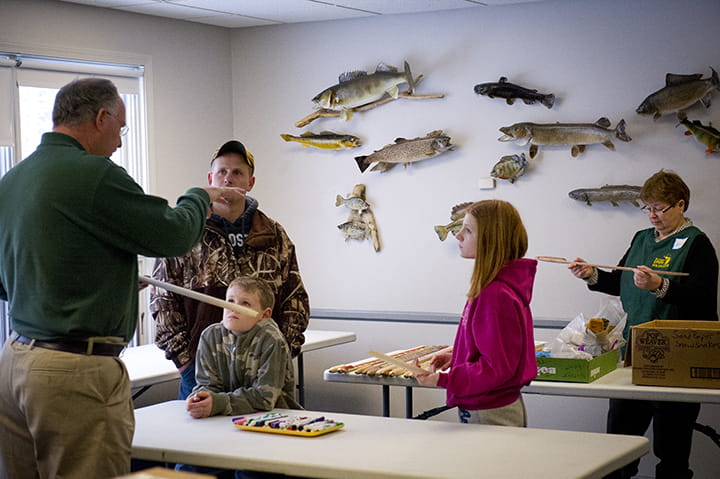 A volunteer leads a program for free fishing weekend. 