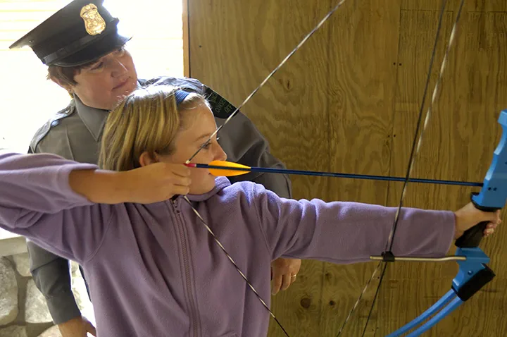 A girl learning archery