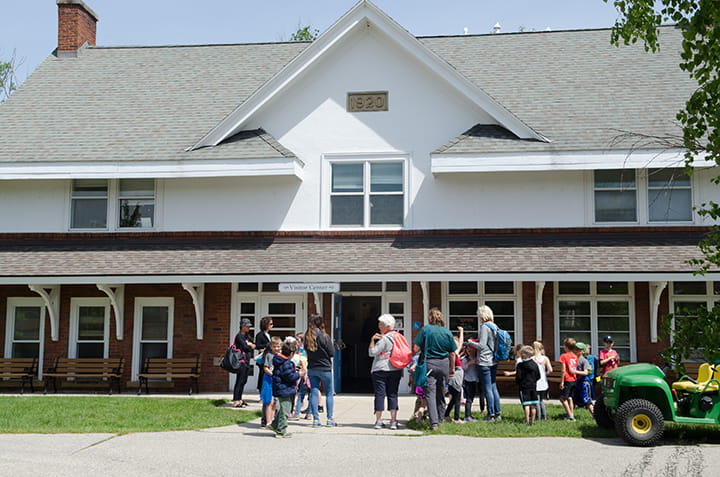 A group standing in the entrance of the Oden Visitor Center