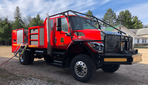 A red truck used for firefighting 