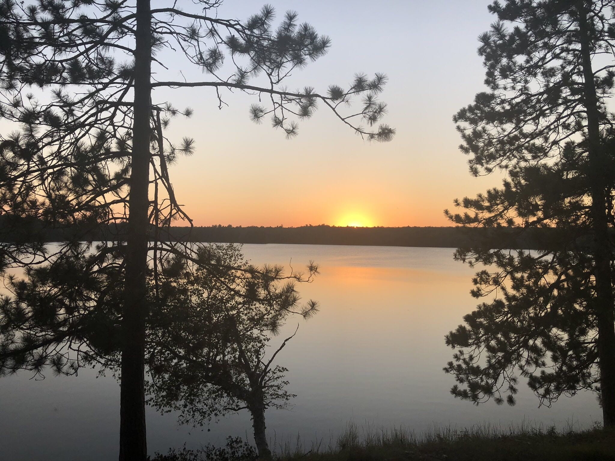 Sunset over the water on the property