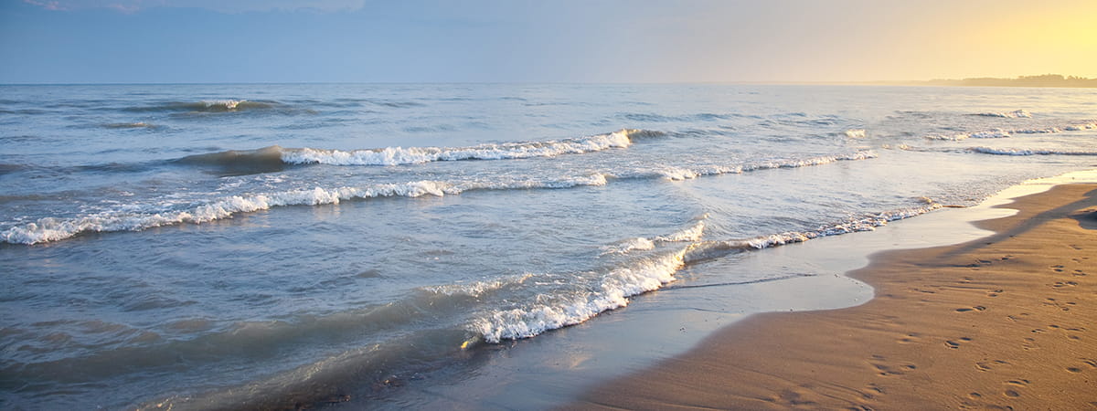 water lapping on sandy lakeshore