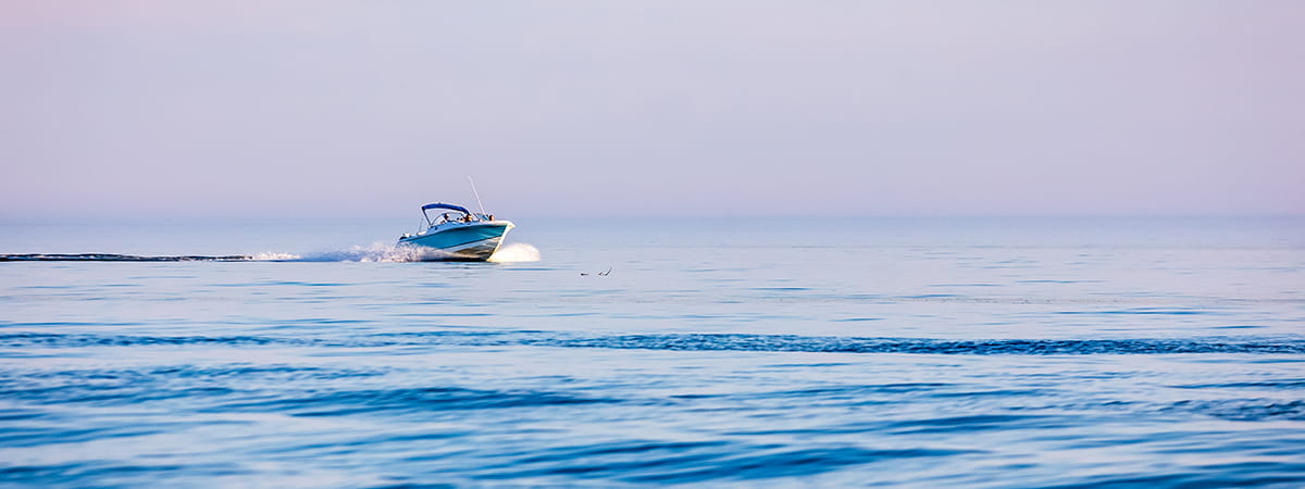 single boat moving across the water