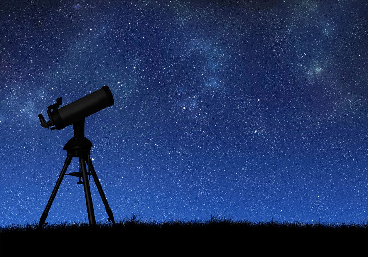 Night sky with stars and telescope