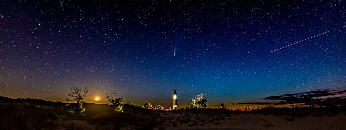 starry sky above lighthouse