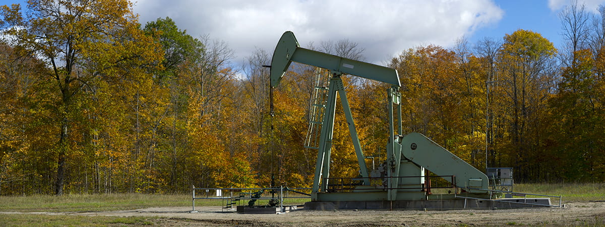 pumping equipment in front of autumn trees