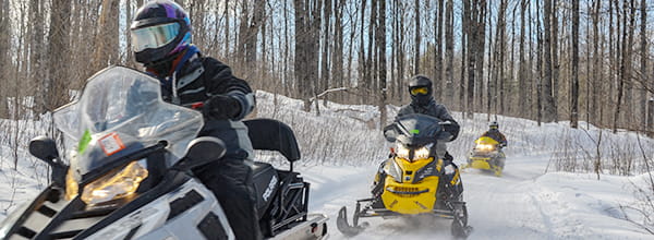 snowmobiles riding trail