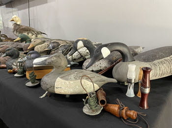 duck decoys displayed on a table