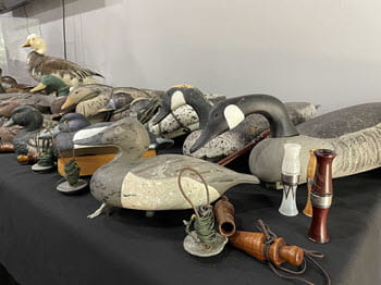 duck decoys displayed on a table