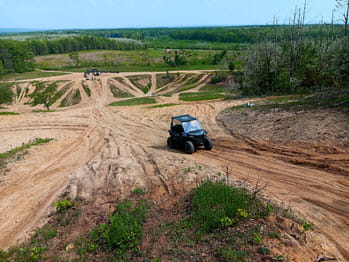 side-by-side operates up a hill