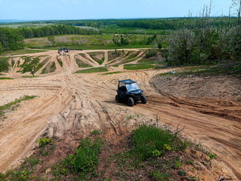 side-by-side operates up a hill
