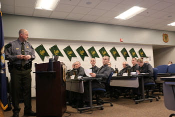 students in a classroom listening to a instructor