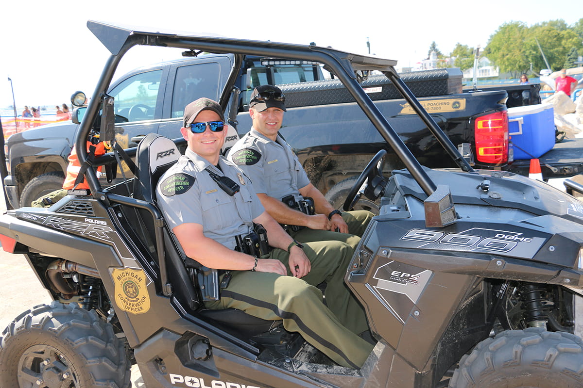 Conservation officers on side by side