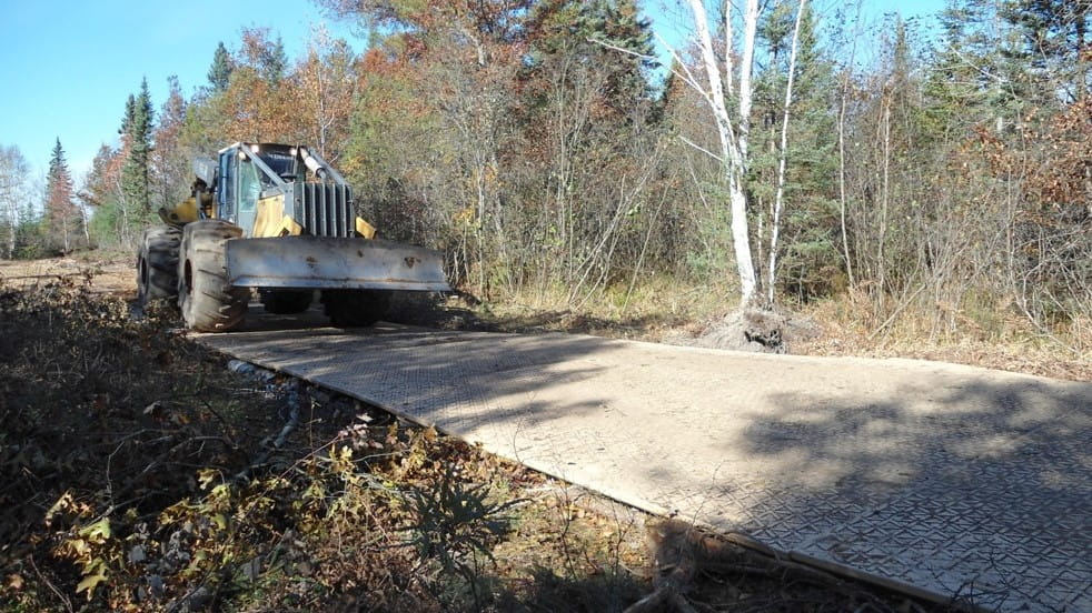 A mat is laid down for machinery to travel over, protecting the landscape
