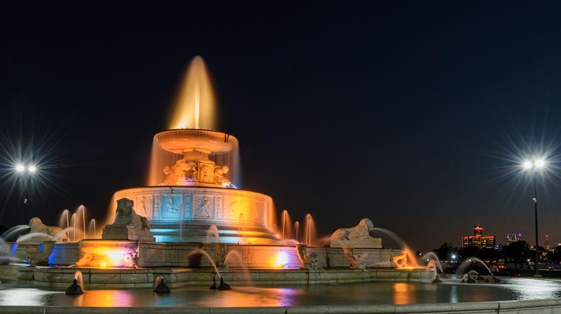 The James Scott Memorial Fountain lit up at night on Belle Isle