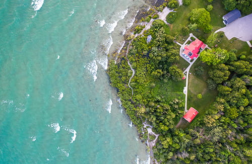 bird's eye view of lighthouse and shoreline