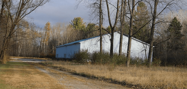 a polebarn in a clearing