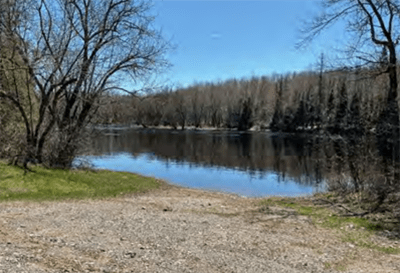 A boating access to a lake surrounded by trees