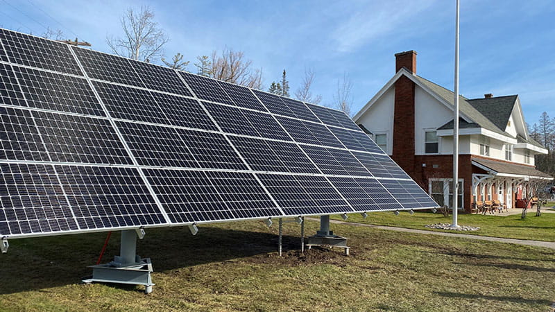 An array of solar panels in front of the Oden Fish Hatchery Visitor Center