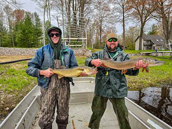 Two DNR staffers are pictured with a walleye and northern pike captured and released in Secord Lake