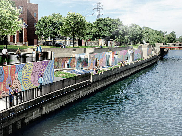 walkway along river with murals