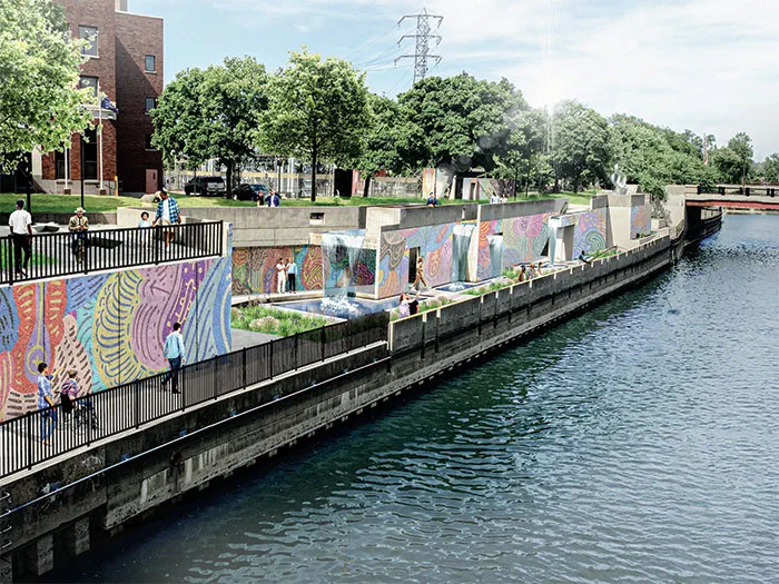 walkway along river with murals