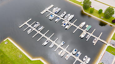 bird's eye view of boats parked in slips at harbor