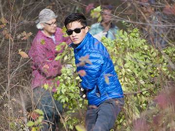 Volunteers pull invasive plants during a stewardship workday