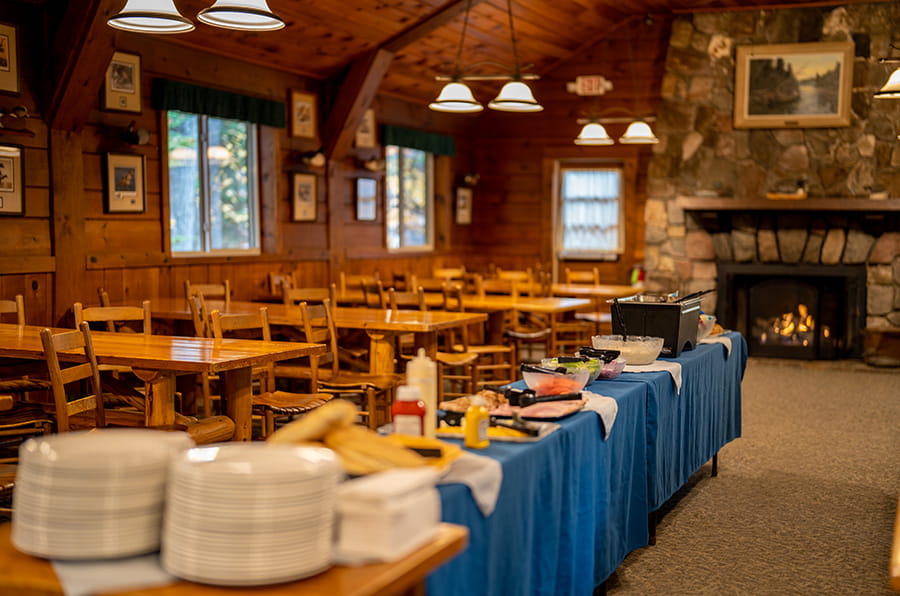 buffet table with food in the center of dining room