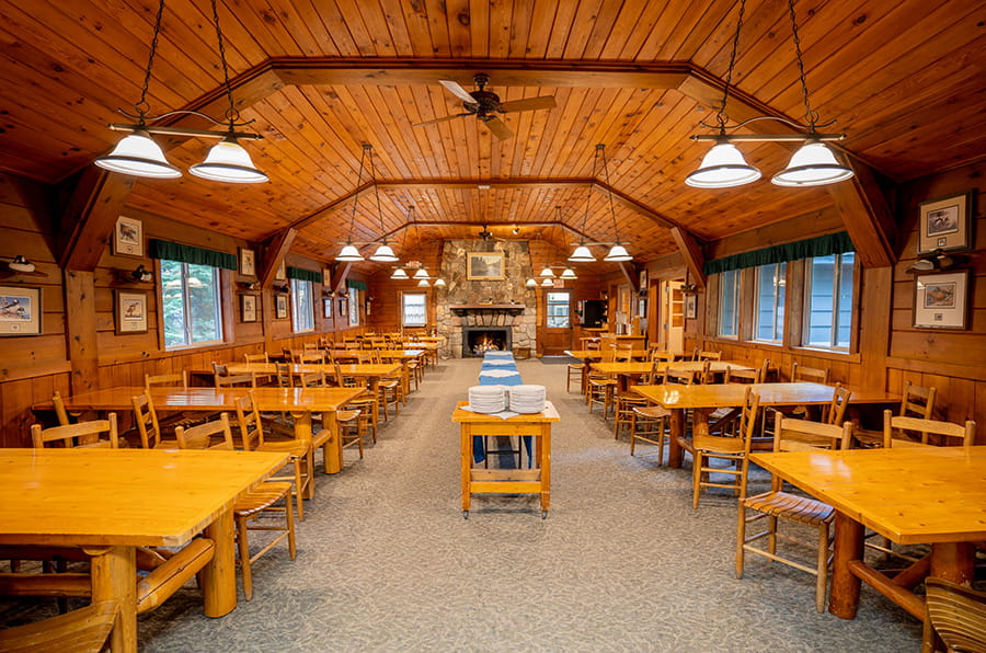 wooden tables, chair, serving table and fireplace