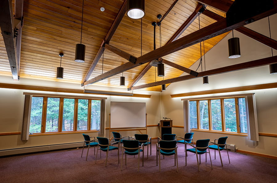 Straits meeting room with chairs, wooden vaulted ceilings, chairs and lecturn