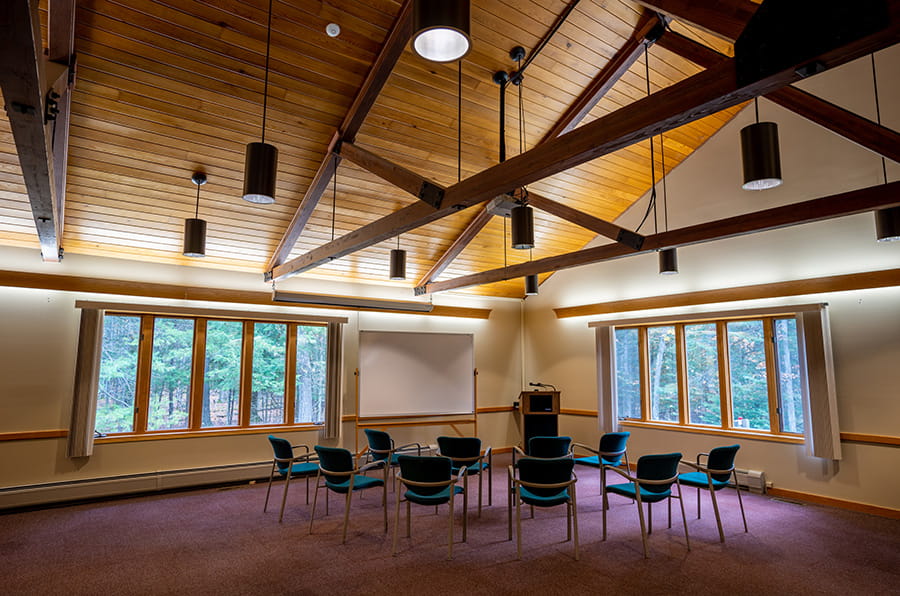Straits meeting room with chairs, wooden vaulted ceilings, chairs and lecturn