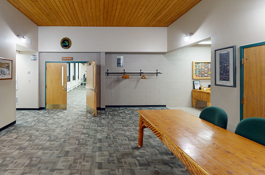table in hallway, hangers and rod